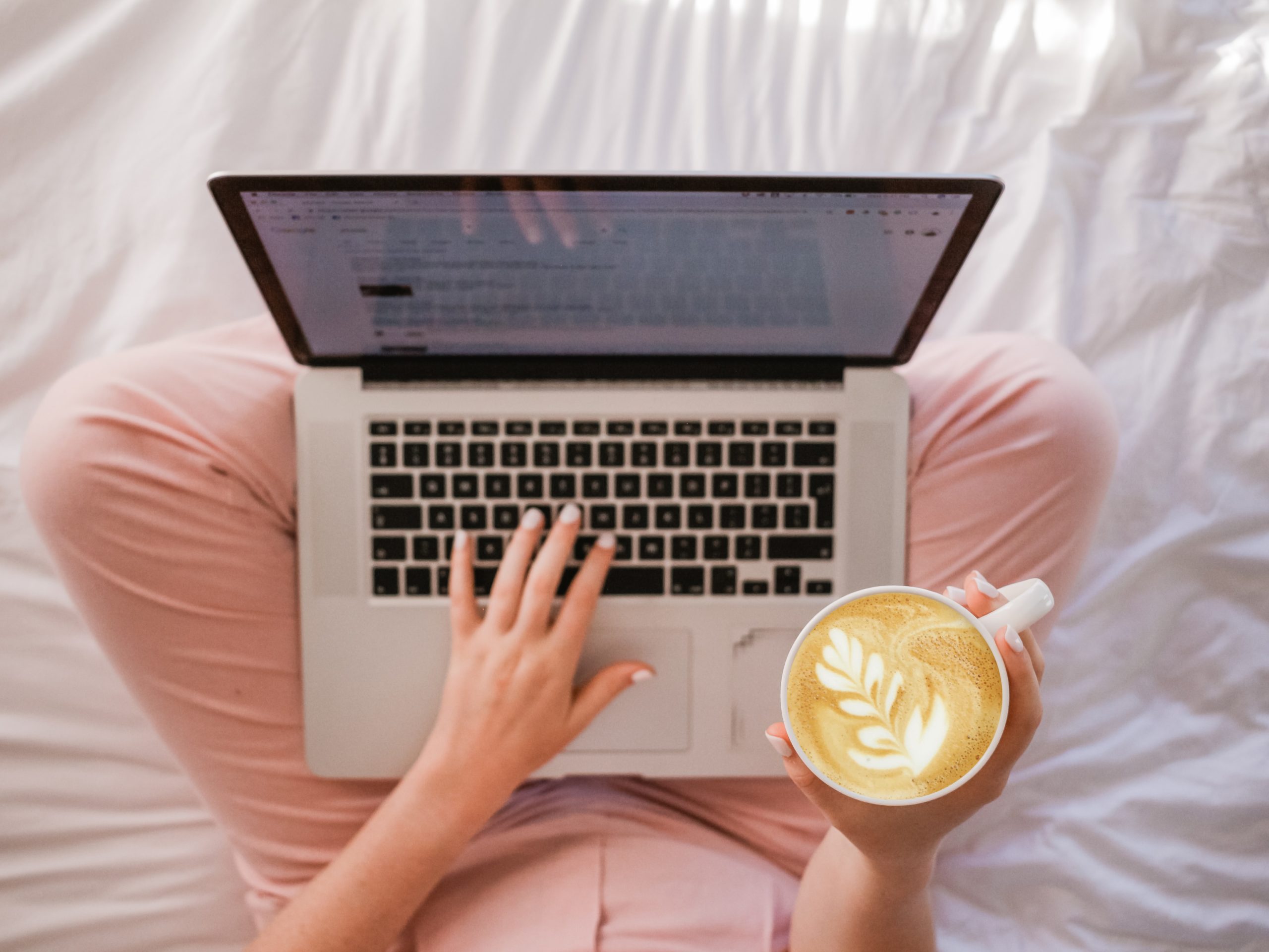woman on her laptop with coffee