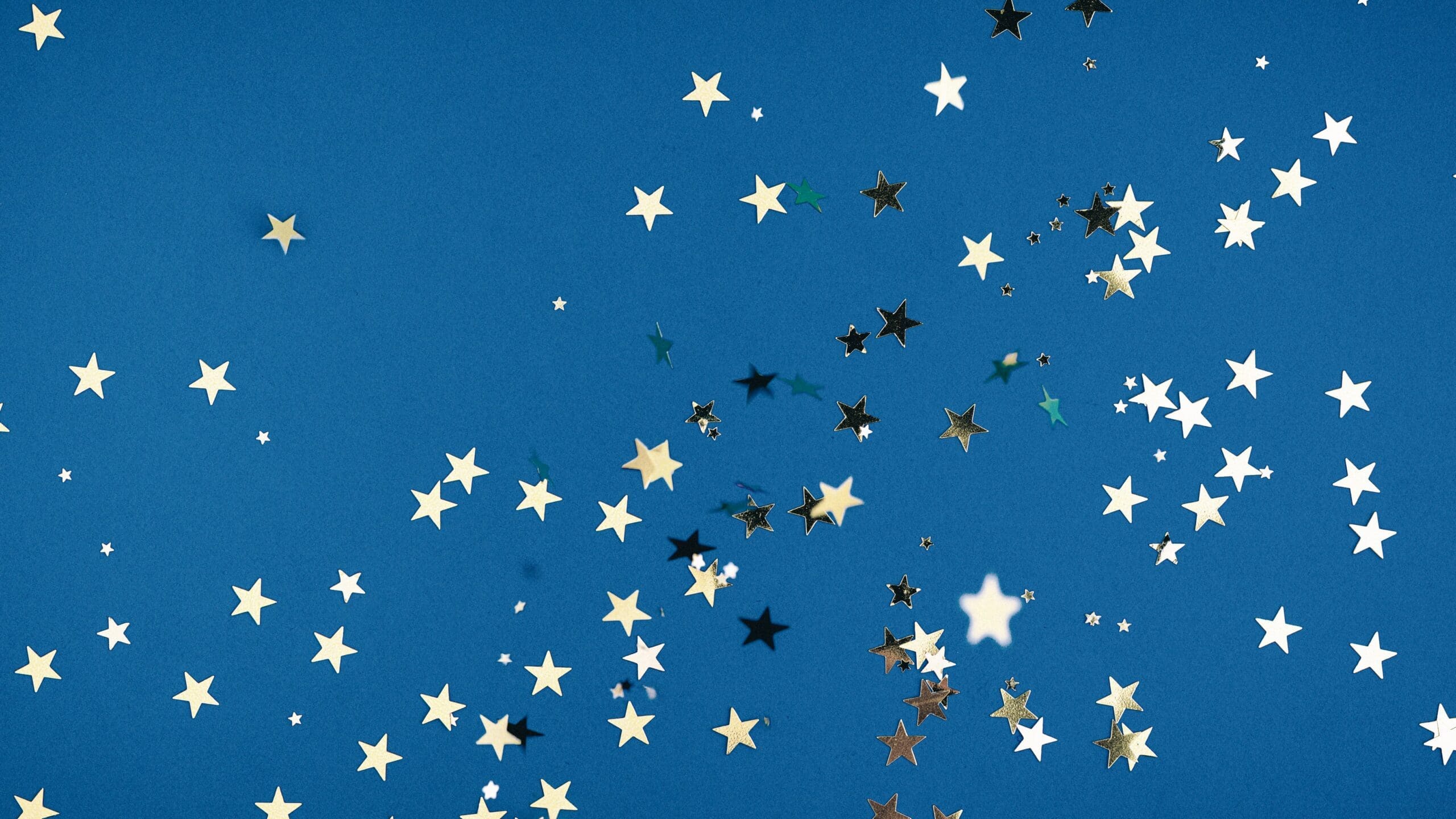 star confetti on a blue background | carlisledigitalmarketing.com